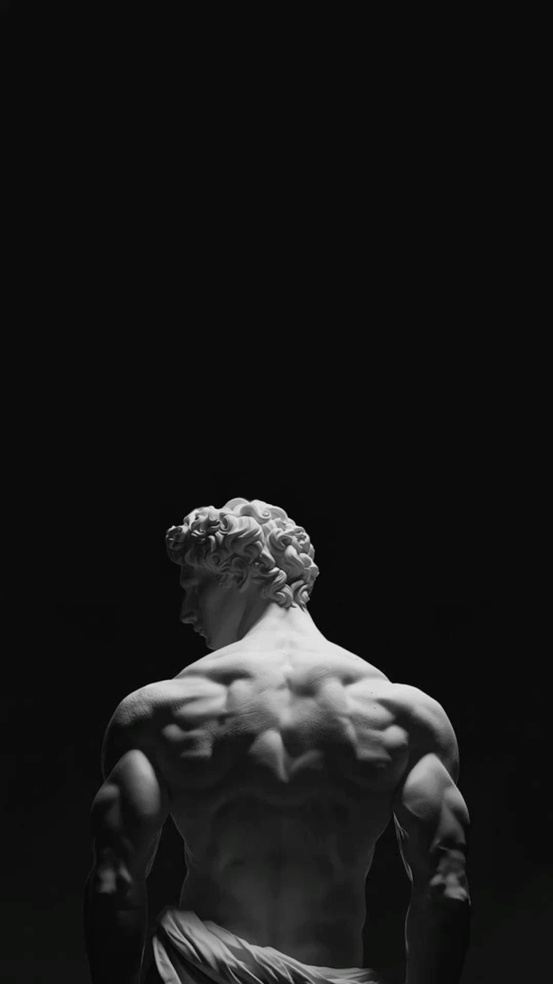 Classical sculpture of a muscular male back representing strength and discipline